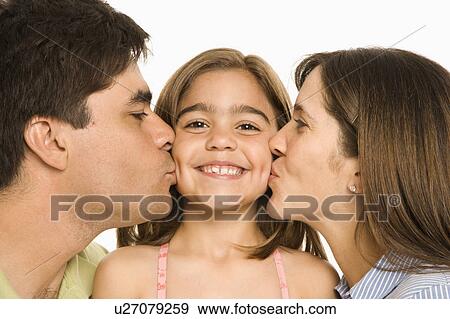 Stock Photo - Mother and father kissing smiling daughter. Fotosearch