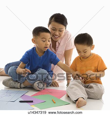 Mother with boys coloring View Large Photo Image Stock Photo - Mother with boys coloring. Fotosearch