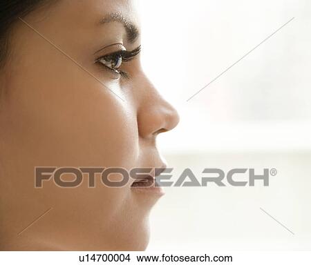 Picture - Close up profile of Hispanic young adult womans face.. Fotosearch