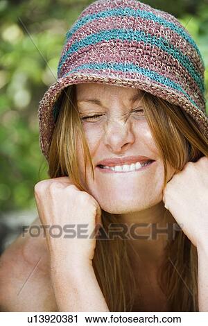Portrait of pretty redhead with goofy expression on her face wearing hat. View Large Photo Image Stock Image - Portrait of pretty redhead with goofy expression on her face wearing hat.. Fotosearch