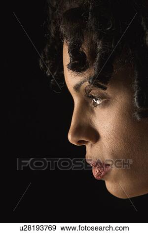 Stock Photo - Profile of mid adult Hispanic woman with curly hair.. Fotosearch