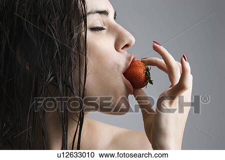 Topless caucasian woman biting a strawberry. View Large Photo Image Stock Image - Topless caucasian woman biting a strawberry.. Fotosearch