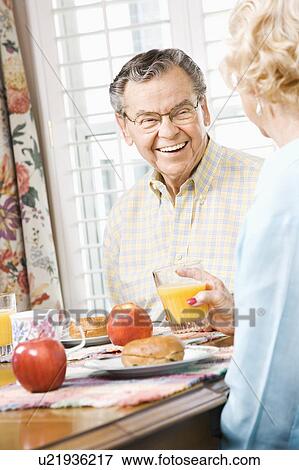 Stock Photo - Couple having breakfast together. Fotosearch