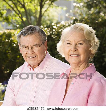 Stock Image - Mature Caucasian couple looking at viewer.. Fotosearch
