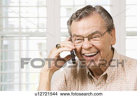 Picture - Senior man talking on cellphone. Fotosearch