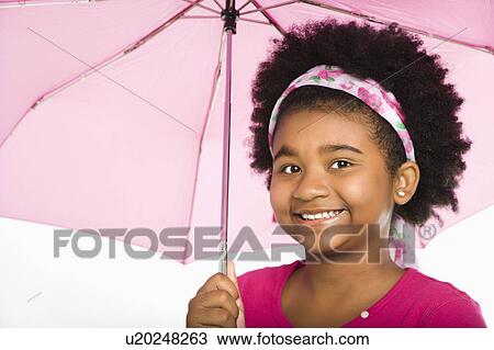 Girl holding pink umbrella smiling View Large Photo Image Stock Image - Girl holding pink umbrella smiling. Fotosearch