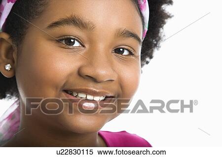 Stock Photography - Girl wearing headband smiling. Fotosearch