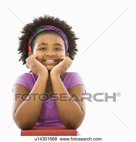 Stock Photo - Girl with head resting on hands . Fotosearch