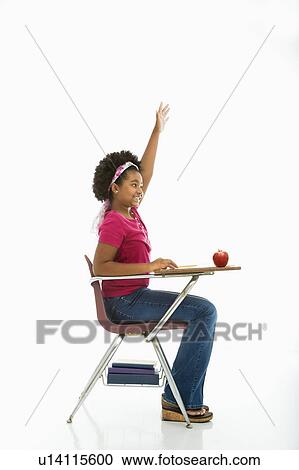 Side view of African American girl sitting in school desk raising hand. View Large Photo Image Stock Image - Side view of African American girl sitting in school desk raising hand.. Fotosearch