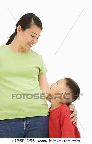 Stock Photography - Asian mother and son looking at eachother.. Fotosearch