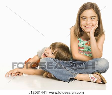 Stock Image - Boy laying head on girls leg. Fotosearch