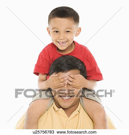 Boy sitting on father's shoulders View Large Photo Image Stock Image - Boy sitting on father's shoulders. Fotosearch