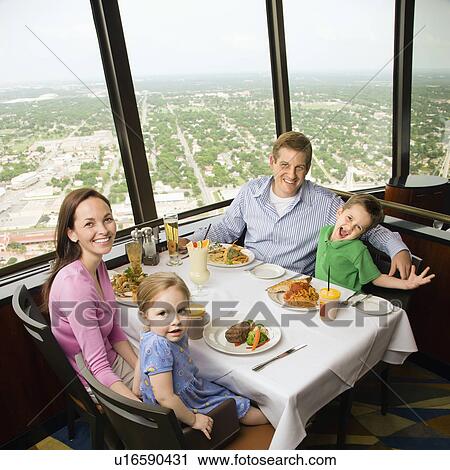 Caucasian family having dinner together at Tower of Americas restaurant in San Antonio, Texas. View Large Photo Image Stock Image - Caucasian family having dinner together at Tower of Americas restaurant in San Antonio, Texas.. Fotosearch