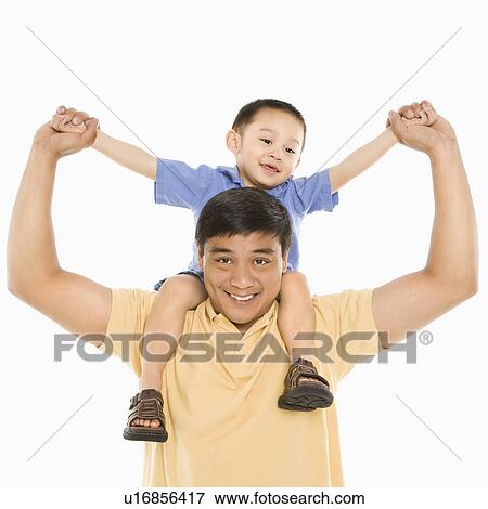 Stock Photo - Father holding son on shoulders . Fotosearch