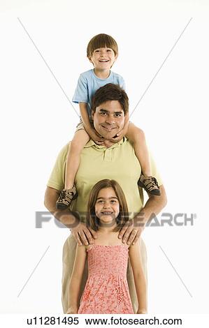 Stock Photography - Father with son and daughter standing against white background.. Fotosearch