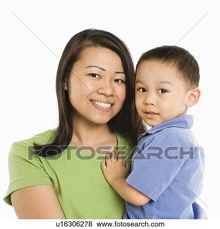 Stock Photo - Mother holding son smiling. Fotosearch