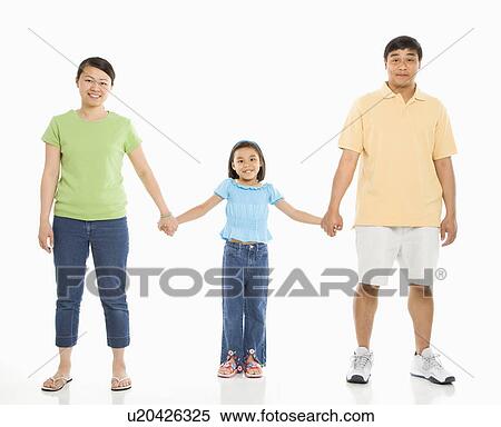 Stock Photography - Parents holding hands with daughter . Fotosearch
