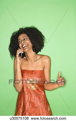 Stock Photo - African-American woman talking on cellphone.. Fotosearch