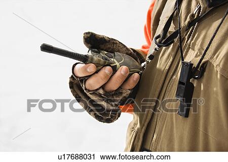 Caucasian male hand holding walkie talkie. View Large Photo Image Stock Image - Caucasian male hand holding walkie talkie.. Fotosearch