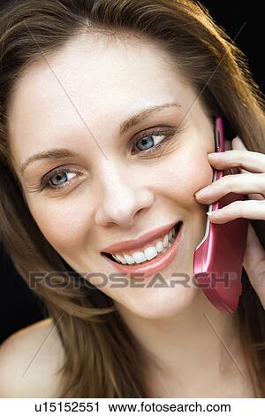 Close up portrait of young adult female talking on mobile phone and smiling. View Large Photo Image Stock Image - Close up portrait of young adult female talking on mobile phone and smiling.. Fotosearch