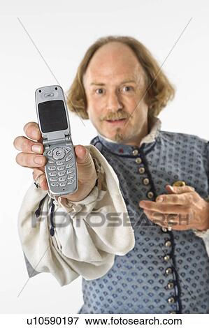 William Shakespeare clothing holding cell phone View Large Photo Image Stock Photo - William Shakespeare clothing holding cell phone. Fotosearch