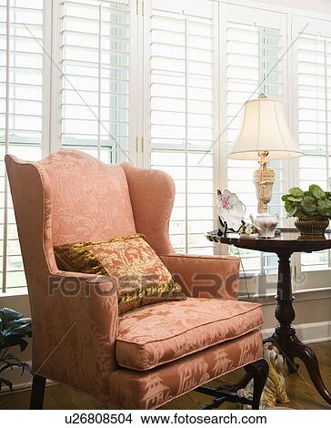 Chair in living room with windows View Large Photo Image Picture - Chair in living room with windows . Fotosearch