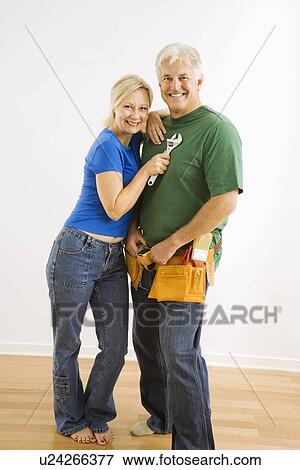 Couple with household tools View Large Photo Image Stock Photo - Couple with household tools. Fotosearch