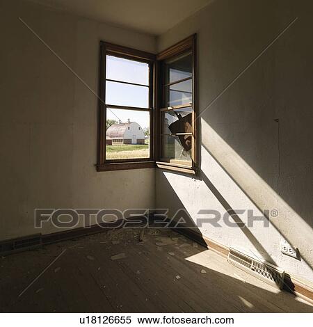 Dark empty abandoned room with sunrays stretching across wall from corner window. View Large Photo Image Stock Photography - Dark empty abandoned room with sunrays stretching across wall from corner window.. Fotosearch