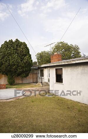 Rear view of home with back yard and patio View Large Photo Image Stock Photo - Rear view of home with back yard and patio. Fotosearch