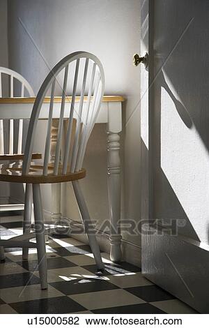 Sunlight lit kitchen with dinette and black and white checkerboard tiled floor. View Large Photo Image Stock Image - Sunlight lit kitchen with dinette and black and white checkerboard tiled floor.. Fotosearch