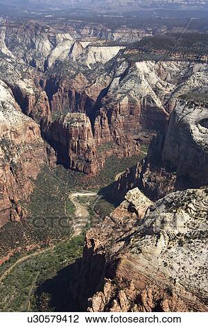 Stock Image - Aerial of desert canyon and river gorge in Utah, USA. Fotosearch