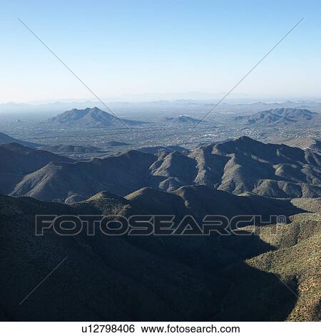 Stock Photograph - Aerial view of Arizona landscape with mountain range. Fotosearch