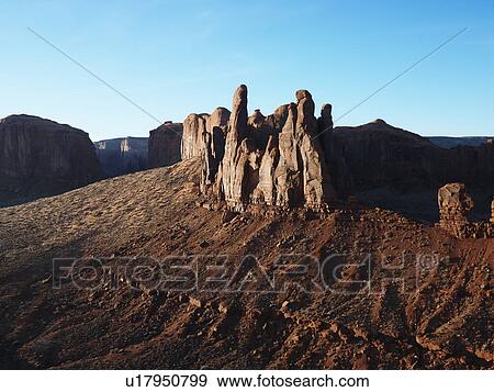 Buttes in southwestern desert landscape of Monument Valley, Utah. View Large Photo Image Stock Photo - Buttes in southwestern desert landscape of Monument Valley, Utah.. Fotosearch