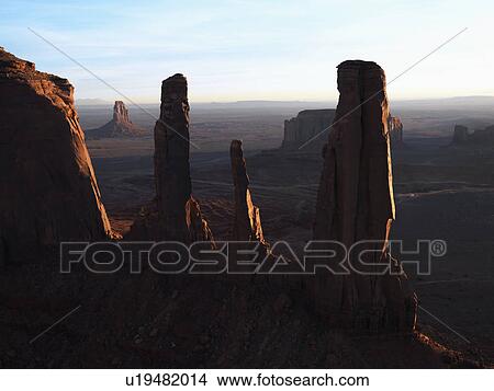 Picture - Three sisters rock formation in Monument Valley. Fotosearch