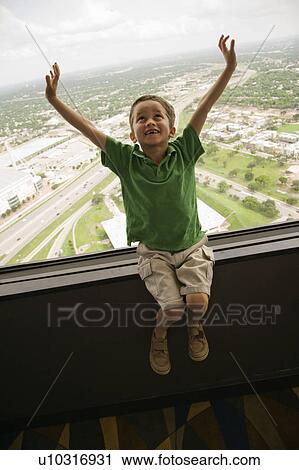 Boy sitting on observation deck at Tower of the Americas in San Antonio, Texas View Large Photo Image Stock Image - Boy sitting on observation deck at Tower of the Americas in San Antonio, Texas. Fotosearch