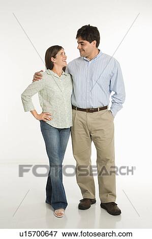 Stock Photo - Couple standing smiling . Fotosearch