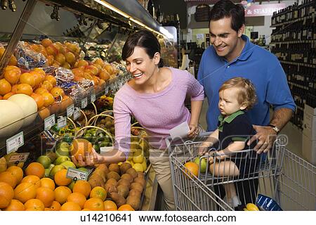 Parents grocery shopping for fruit with toddler View Large Photo Image Stock Image - Parents grocery shopping for fruit with toddler. Fotosearch