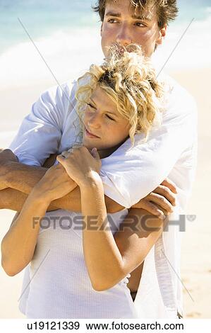Couple embracing on Maui, Hawaii beach View Large Photo Image Stock Photo - Couple embracing on Maui, Hawaii beach. Fotosearch
