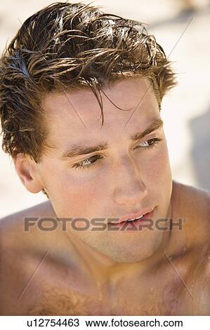 Head and shoulder portrait of handsome man on beach. View Large Photo Image Stock Image - Head and shoulder portrait of handsome man on beach.. Fotosearch