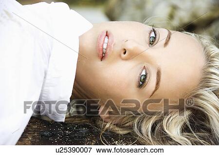 Stock Photo - Portrait of pretty Caucasian woman posing on Maui, Hawaii beach.. Fotosearch