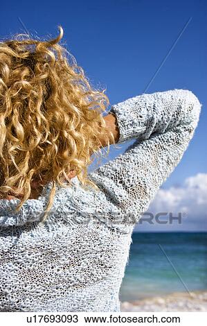Portrait of woman standing on Maui, Hawaii beach looking at ocean View Large Photo Image Stock Image - Portrait of woman standing on Maui, Hawaii beach looking at ocean. Fotosearch