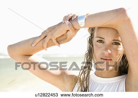 Stock Image - Pretty Caucasian blond woman on Maui, Hawaii beach.. Fotosearch