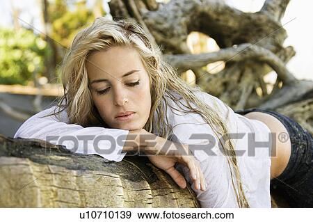 Stock Photo - Pretty Caucasian woman posing on Maui, Hawaii beach.. Fotosearch