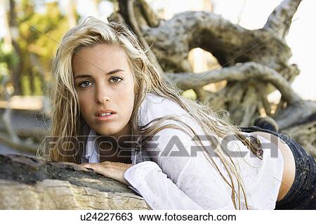 Stock Image - Pretty woman posing on Maui, Hawaii beach. Fotosearch