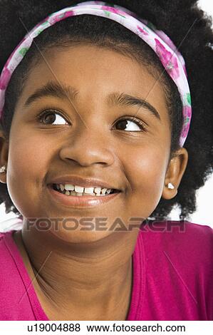 African American girl wearing headband looking to the side. View Large Photo Image Stock Photo - African American girl wearing headband looking to the side.. Fotosearch