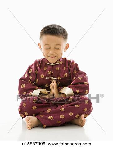 Boy sitting meditating View Large Photo Image Stock Photography - Boy sitting meditating. Fotosearch