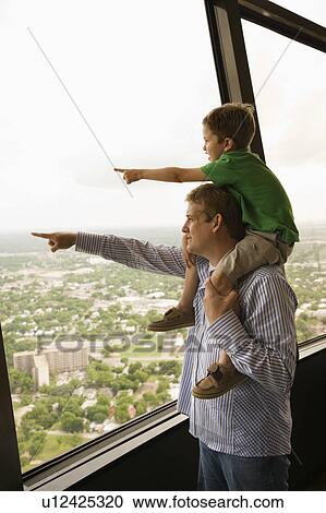 Father and son pointing from observation deck at Tower of the Americas in San Antonio, Texas View Large Photo Image Stock Image - Father and son pointing from observation deck at Tower of the Americas in San Antonio, Texas. Fotosearch