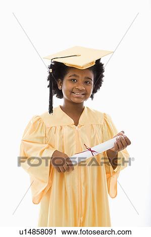 Girl in graduation robe and hat holding diploma View Large Photo Image Stock Image - Girl in graduation robe and hat holding diploma. Fotosearch