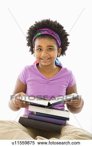 Stock Photography - Girl with large stack of books. Fotosearch