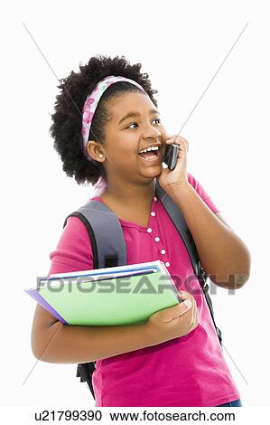 Stock Image - Girl with talking on cell phone. Fotosearch
